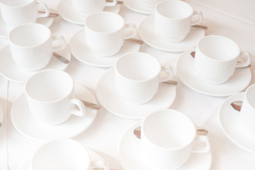 Group of white coffee cups in cafe bar