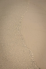 Small waves lapped the beach