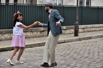 Couple dancing in a street of Montmartre