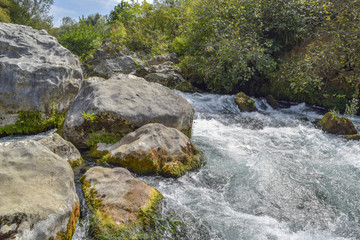 Naklejka na ściany i meble Rapids and rocks on the Cetina River in Omis, Croatia
