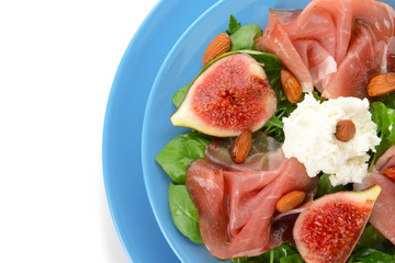 Plates with delicious fig salad on white background