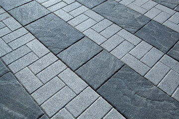 city gray paving tiles close up