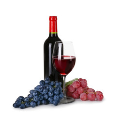 Glassware of red wine with ripe grapes on white background