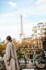 Woman enjoying view on the Eiffel tower walking in Paris