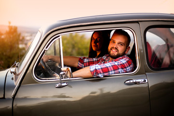 Young Couple Trip With Vintage Car