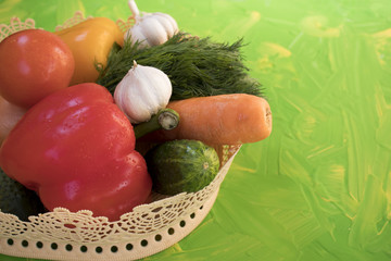 vegetables in vase on multicolored background, copy space, advertising space