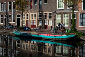 20 August 2018, Leiden, Netherlands:Reflection of the tradional Dutch houses in canal water