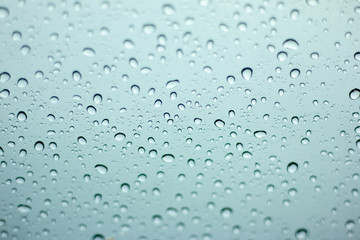 Rain drops on the windshield.