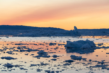 Midnight sun lighting up the glacier. Disko bay, Greenland. © Kertu