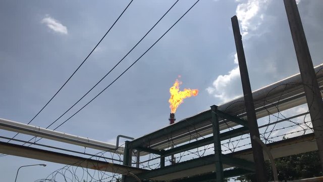 Flare tower in Refinery plant during burn out gas from refinery process