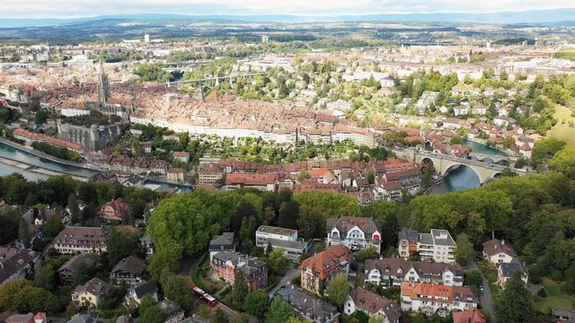 Aerial panoramic view of cityscape of Bern, historic city center above crook in turquoise river Aare - landscape panorama of capital city of Switzerland from above, Europe