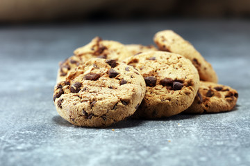Chocolate cookies on rustic table. Chocolate chip cookies shot