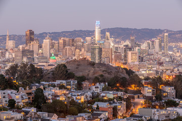 Dusk over San Francisco Downtown with Columbus Day Lights. Shot from Tank Hill, Cole Valley - Twin Peaks. 