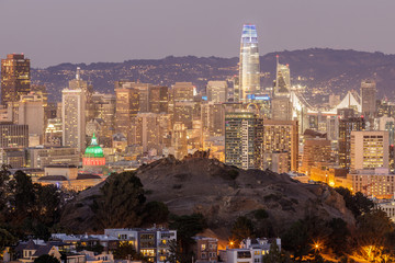 Dusk over San Francisco Downtown with Columbus Day Lights. Shot from Tank Hill, Cole Valley - Twin Peaks.