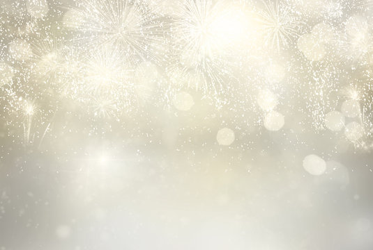 Abstract festive silver winter bokeh background with fireworks and bokeh lights