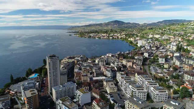 Aerial panoramic view of city of Montreux, resort town by Geneva Lake (Lac Leman), late summer - landscape panorama of Switzerland from above, Europe