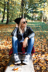 young woman enjoying autumn outdoors