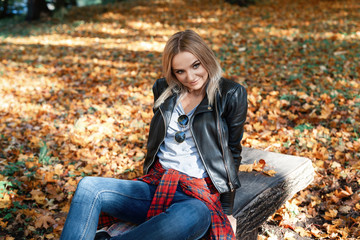 young woman enjoying autumn outdoors