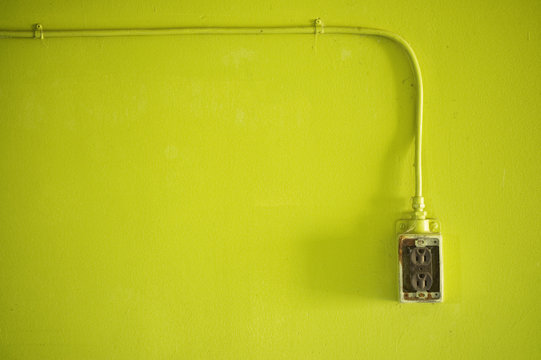 Electrical Outlet On Lime Green Wall