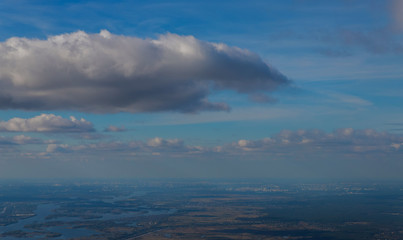 A view from the window of the plane flying at big height The airlines plane wing in the sky