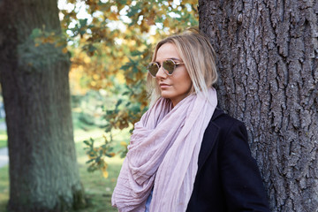 young woman enjoying autumn outdoors