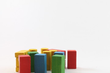 diverse compositions with colored wooden architecture game pieces
