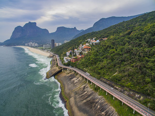 Highway by the sea. Wonderful road and bike path. Bicycle and road track and next to the blue sea in the city of Rio de Janeiro. Tim Maia bike path on Niemeyer Avenue, Rio de Janeiro, Brazil.