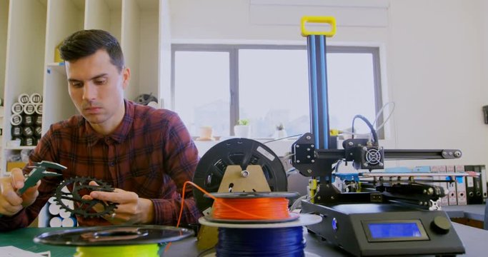 Mechanic checking diameter of chain ring with vernier calipers 4k