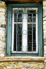 Fototapeta na wymiar Window security bars, Epirus region, Greece.