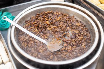 Beondegi, boiled silkworm larvae on street food at Seoul, Korea.