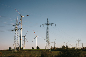 wind turbines and power lines on a field