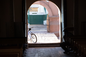 Bicycle in the porch of the church at San Pedro de Atacama, Chile