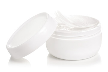 White jar of cream white feather beauty skin care on a white background isolation