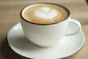A white cup of cappuccino.