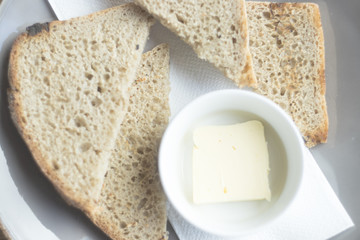 Pieces of bread with butter.