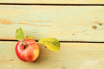 Delicious apples harvested in autumn presented on a rustic surface