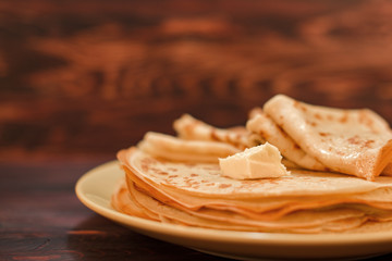 A stack of classic Russian thin pancakes. Rustic style. Traditional Russian Shrovetide (Maslenitsa)