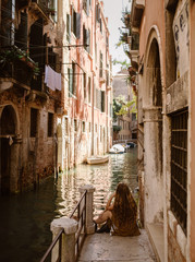traveling woman in venice italy with long hair - 227513322