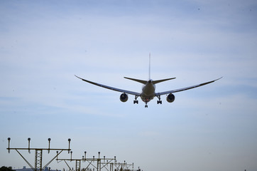 plane landing with quiet sky