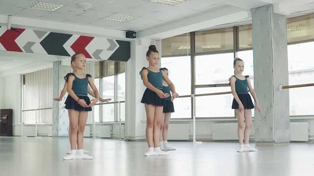 little ballerinas in a ballet lesson. children go to ballet class