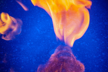 Blue water, cosmic patterns, oil creates space. Outbreak of fire, good contrast.