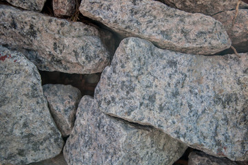 the texture of natural granite stone with outgrowths of MOSS