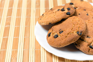 Chocolate oatmeal cookies on a plate top view
