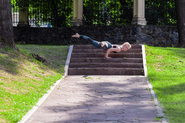 Yoga. Young Woman doing Yoga Exercises Outdoor