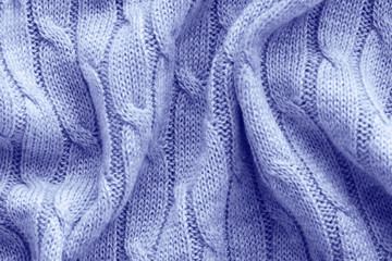 blue knitted background with pigtail pattern