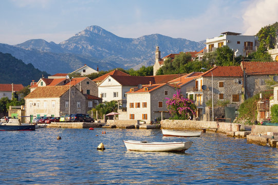 Picturesque Mediterranean landscape with small seaside village. Montenegro, Adriatic Sea, Bay of Kotor, Lepetane village