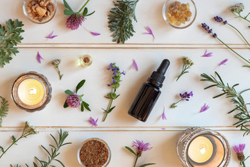 Bottles of essential oil with frankincense, hyssop, lavender and other herbs