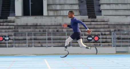 Disabled athletic running on a running track 4k - Powered by Adobe