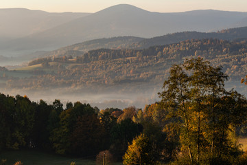 Obraz premium Sunset in mountain landscape. Mountain layers in sunset. Sunset in the mountain forest landscape. Forest and mountains landscape