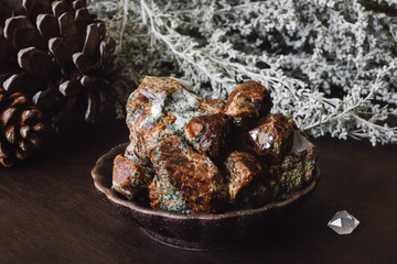 Garnet and Quartz Point with Dried Foliage and Pinecones